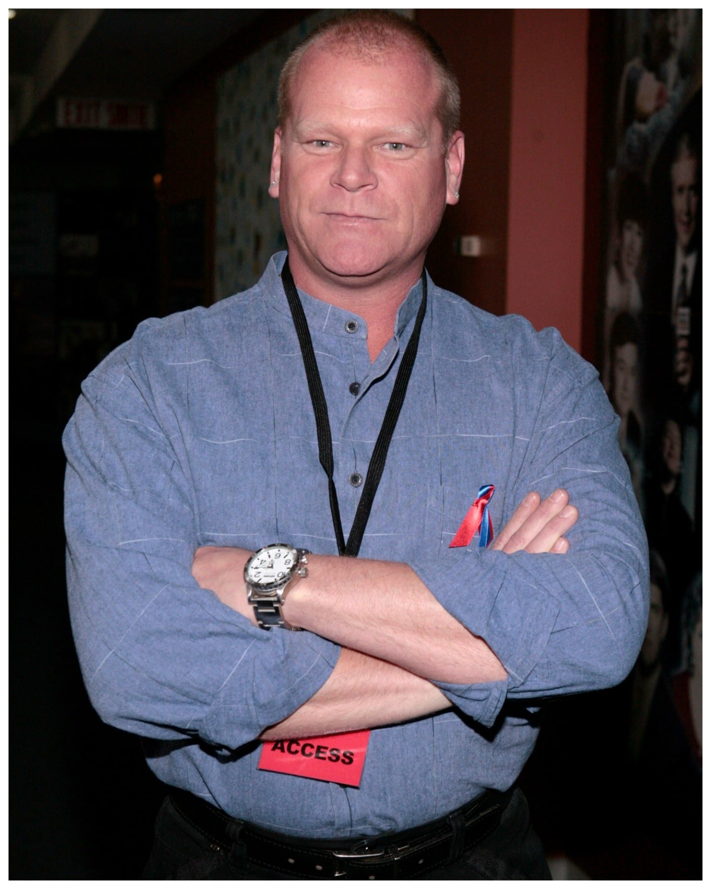 Mike Holmes from 'Holmes Family Rescue' folds arms