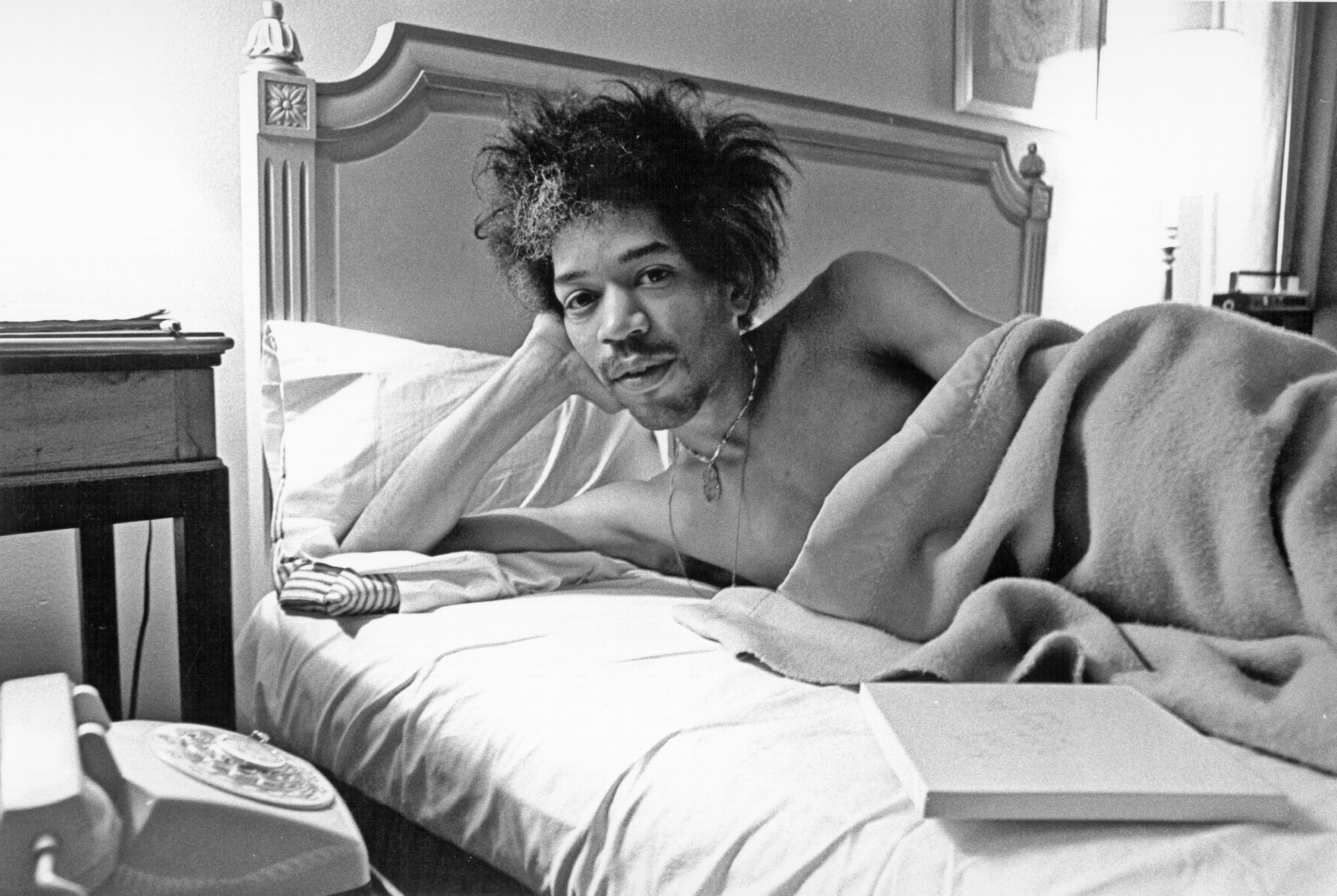 Jimi Hendrix in bed.