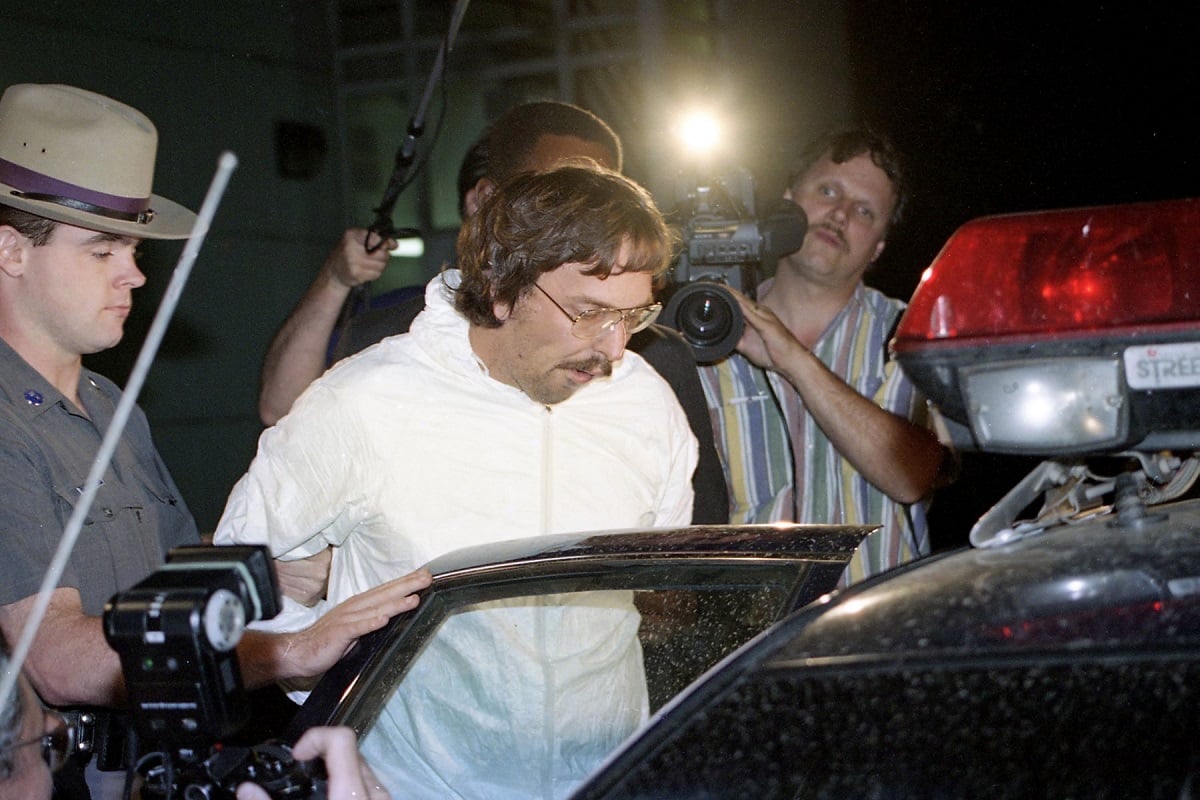 Serial killer Joel Rifkin is seen in handcuffs in Farmingdale, NY after his 1993 arrest