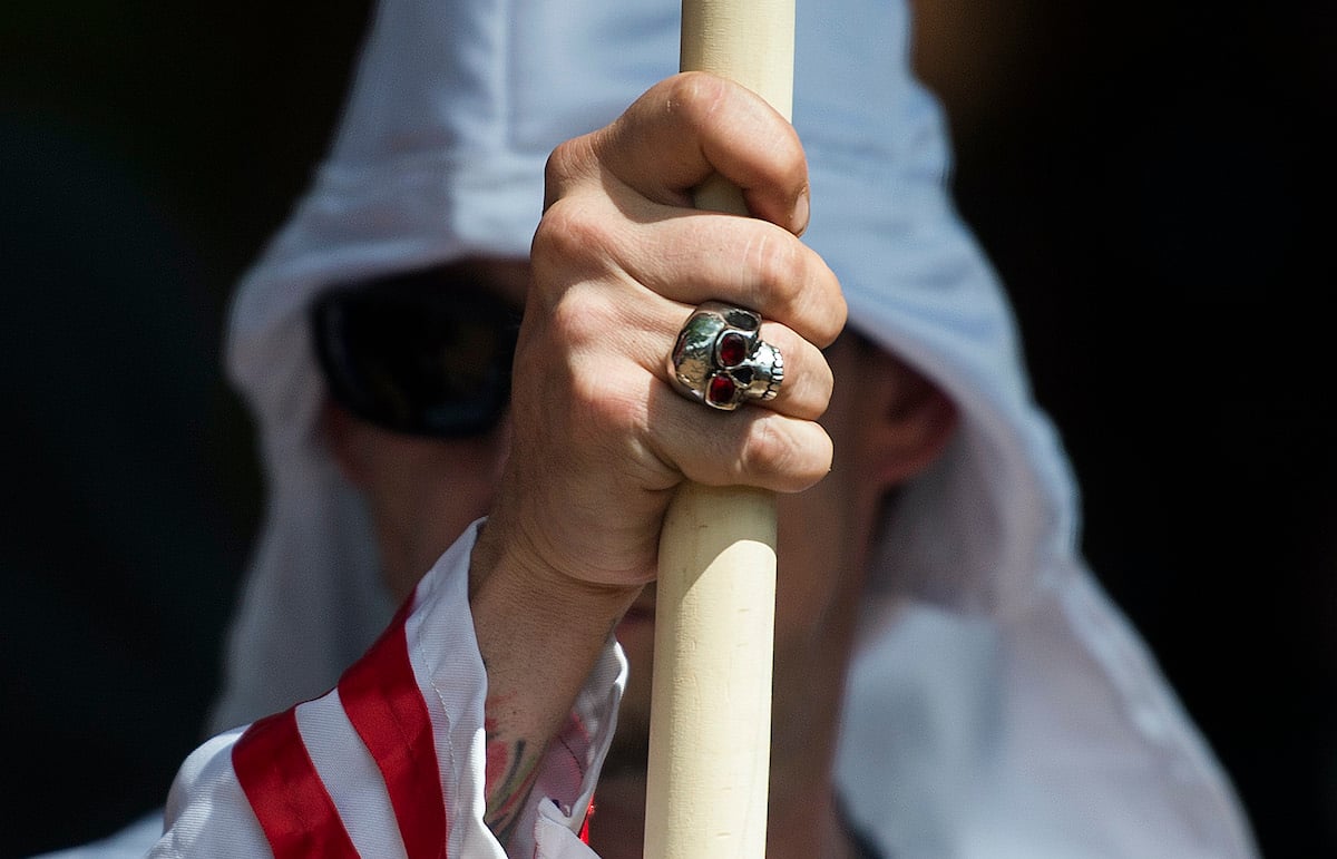 A member of the KKK wearing sunglasses and a skull ring in 2017