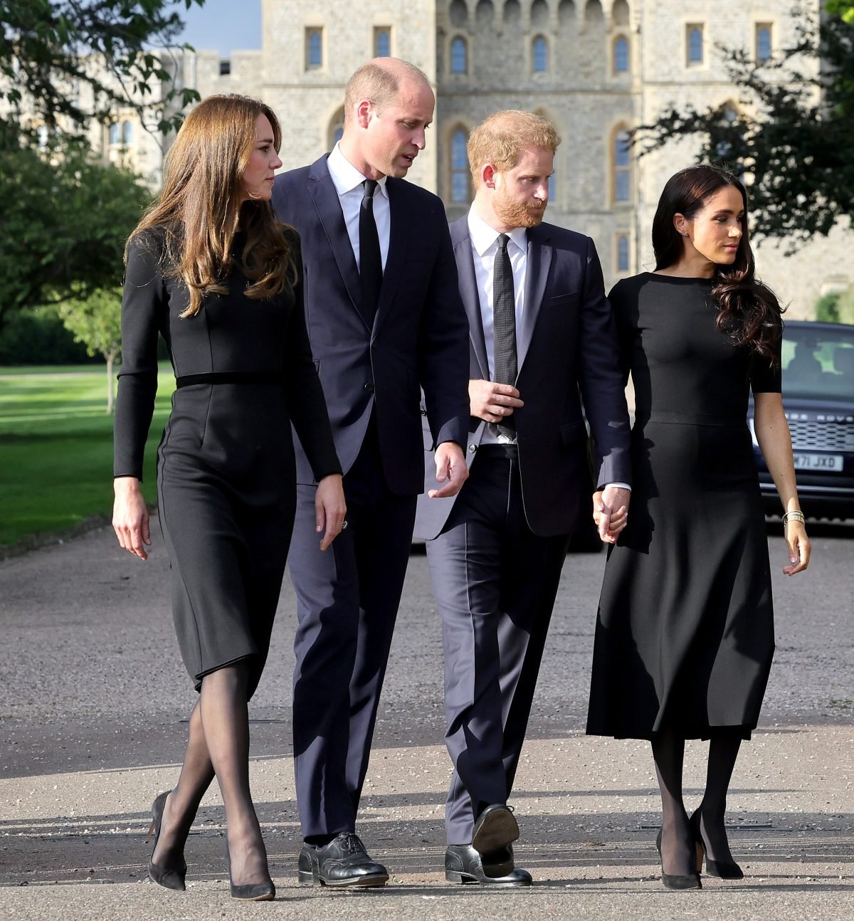 Kate Middleton, Prince William, Prince Harry, and Meghan Markle arrive on the long Walk at Windsor Castle to view flowers and tributes for Queen Elizabeth