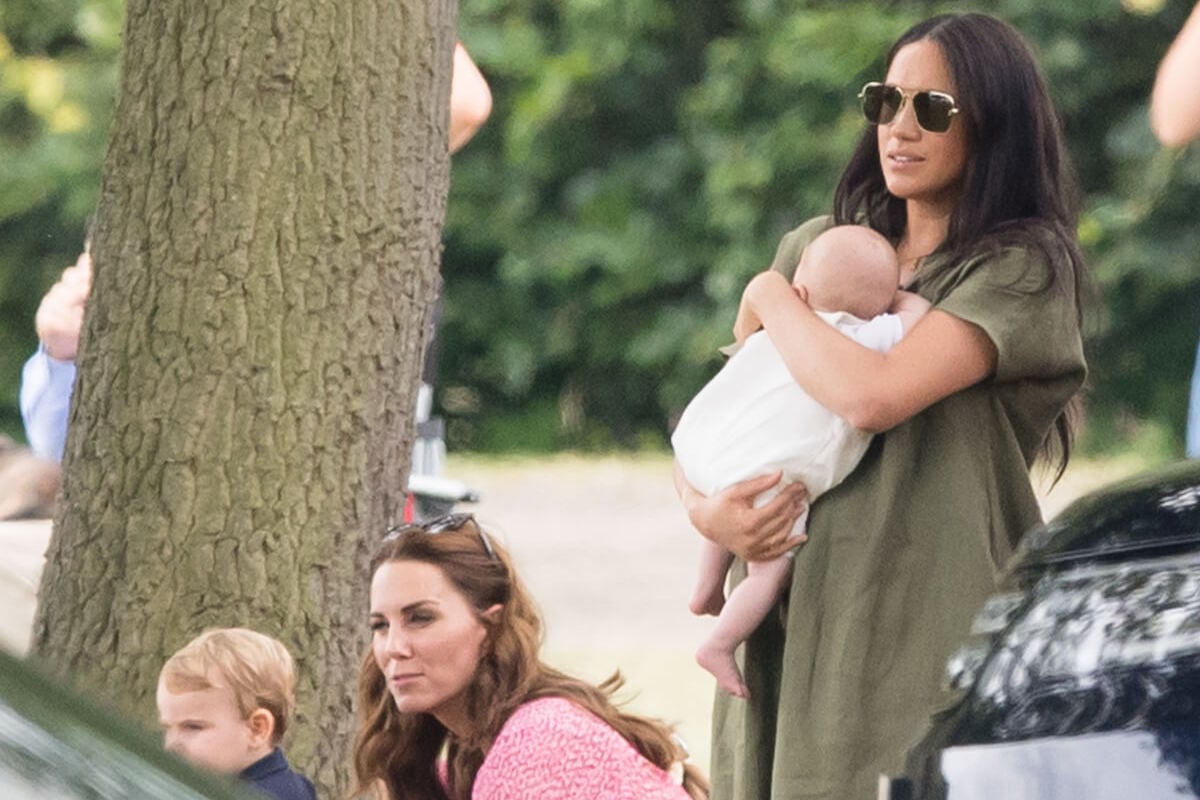 Kate Middleton and Meghan Markle, who might've 'deliberately ignored' each other at a 2019 polo match, according to a body language expert, with Prince Louis and Prince Archie