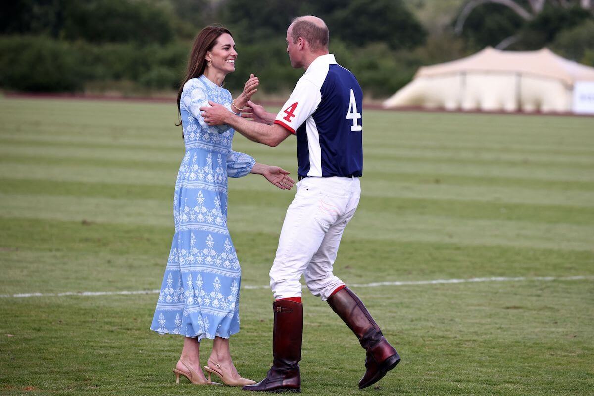 Kate Middleton and Prince William, who were 'relaxed' during a PDA-filled polo match appearance, hug