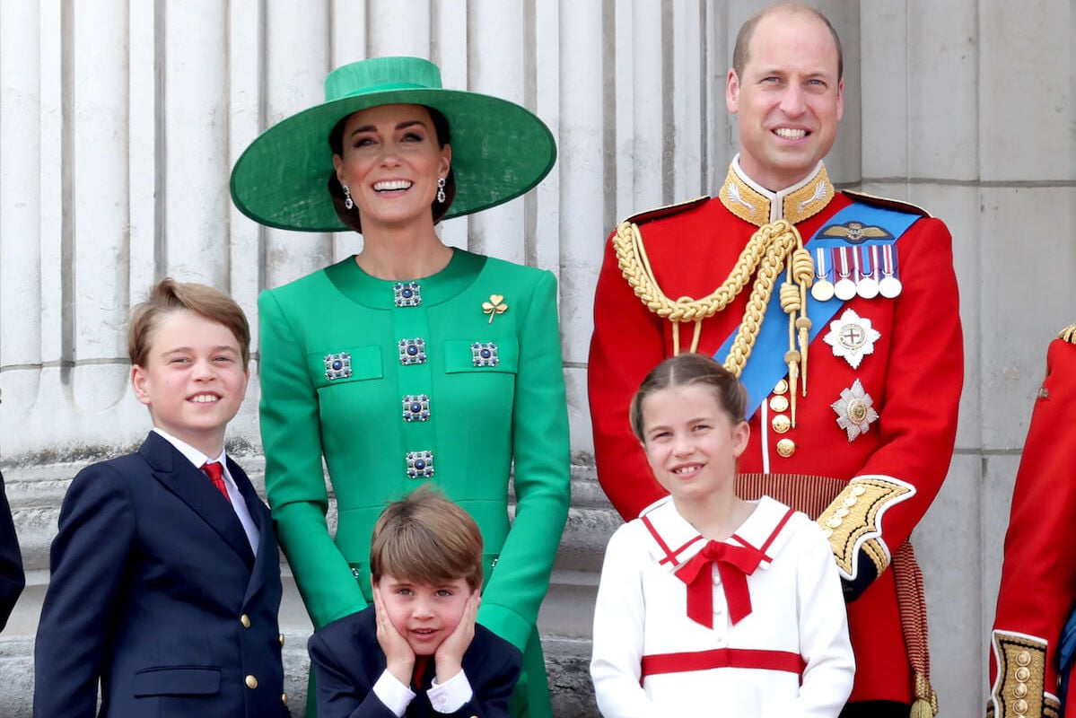 Kate Middleton and Prince William, whose practice of releasing family photos affords them privacy, stand with Prince George, Prince Louis, and Princess Charlotte look on standing on the Buckingham Palace balcony