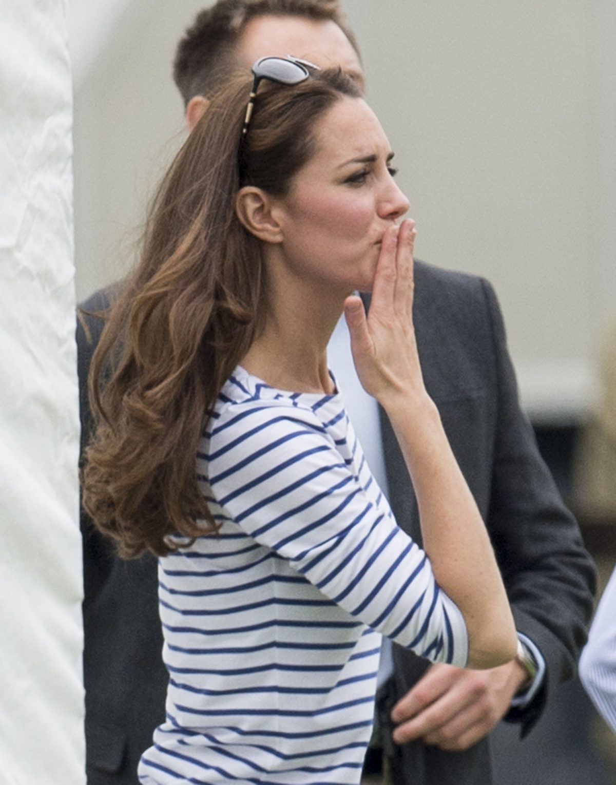 Kate Middleton blows a kiss to Prince William as he plays a match at Cirencester Park Polo Club