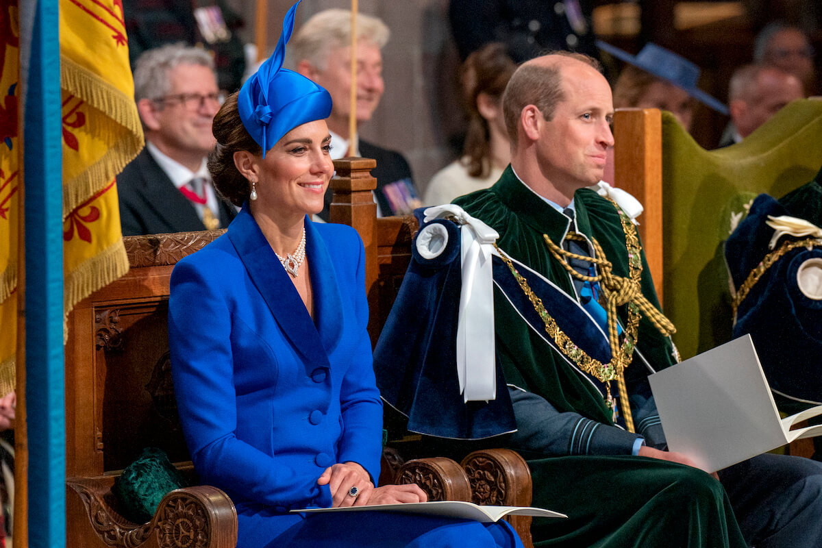 Kate Middleton, one of the royal women an expert says has shaped Prince William into who he is today, sits next to Prince William