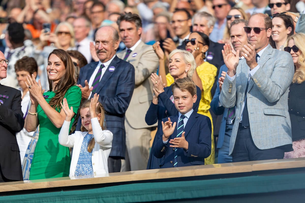 Kate Middleton, the 'leader' at Wimbledon, per a body language expert, stands with Princess Charlotte, Prince George, and Prince William