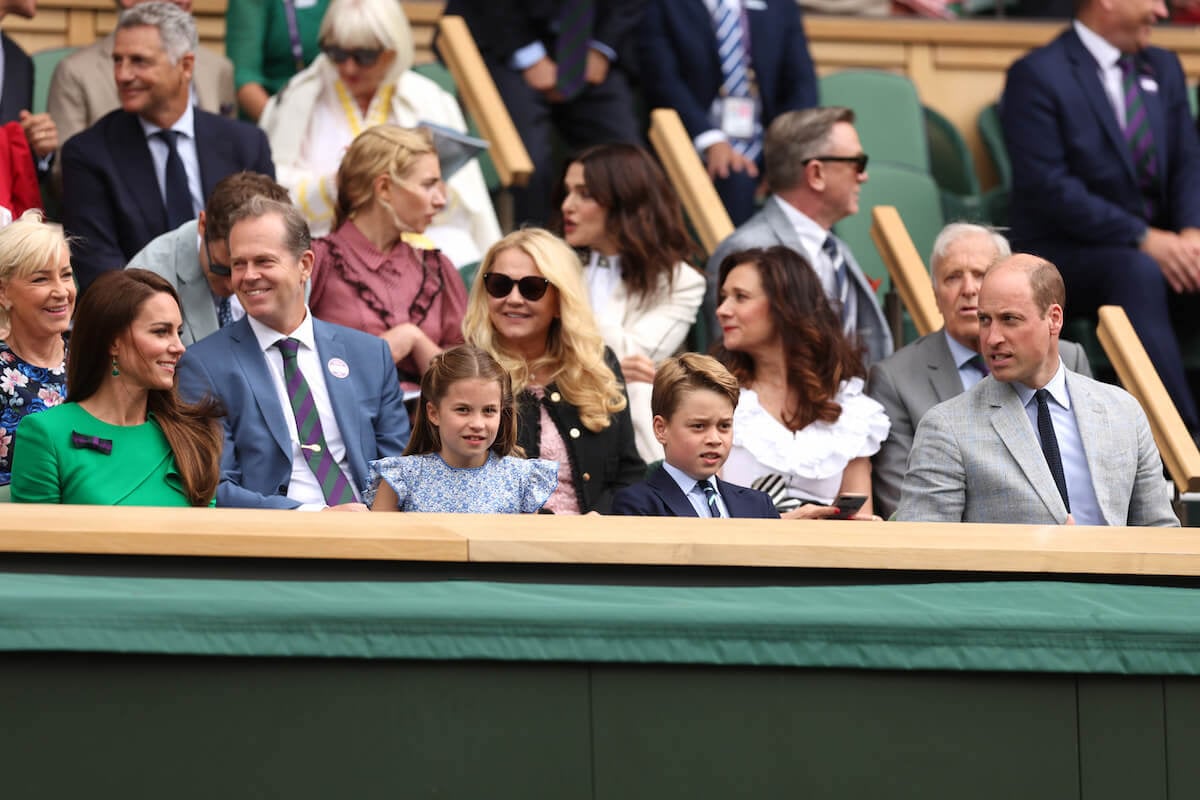 Kate Middleton, who made a 'compelling double-act' with Princess Charlotte at Wimbledon, sits with her daughter, son Prince George, and husband Prince William in the royal box