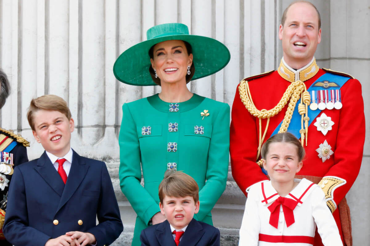 Kate Middleton, who was 'desperate' to leave St. Mary's Lindo Wing after giving birth to Prince George on July 22, 2013, stands with Prince George, Prince Louis, Prince William, and Princess Charlotte