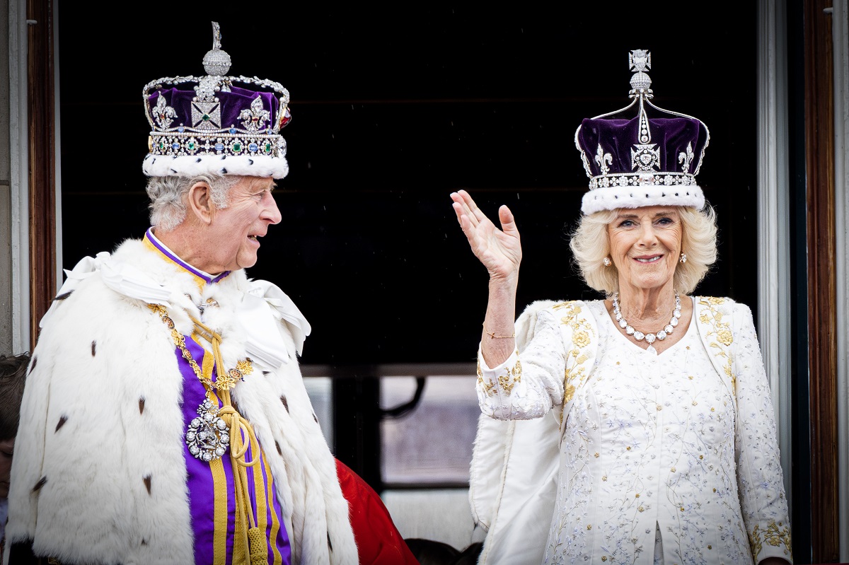 King Charles III and Camilla Parker Bowles (now-Queen Camilla) on the balcony of Buckingham Palace following their coronation