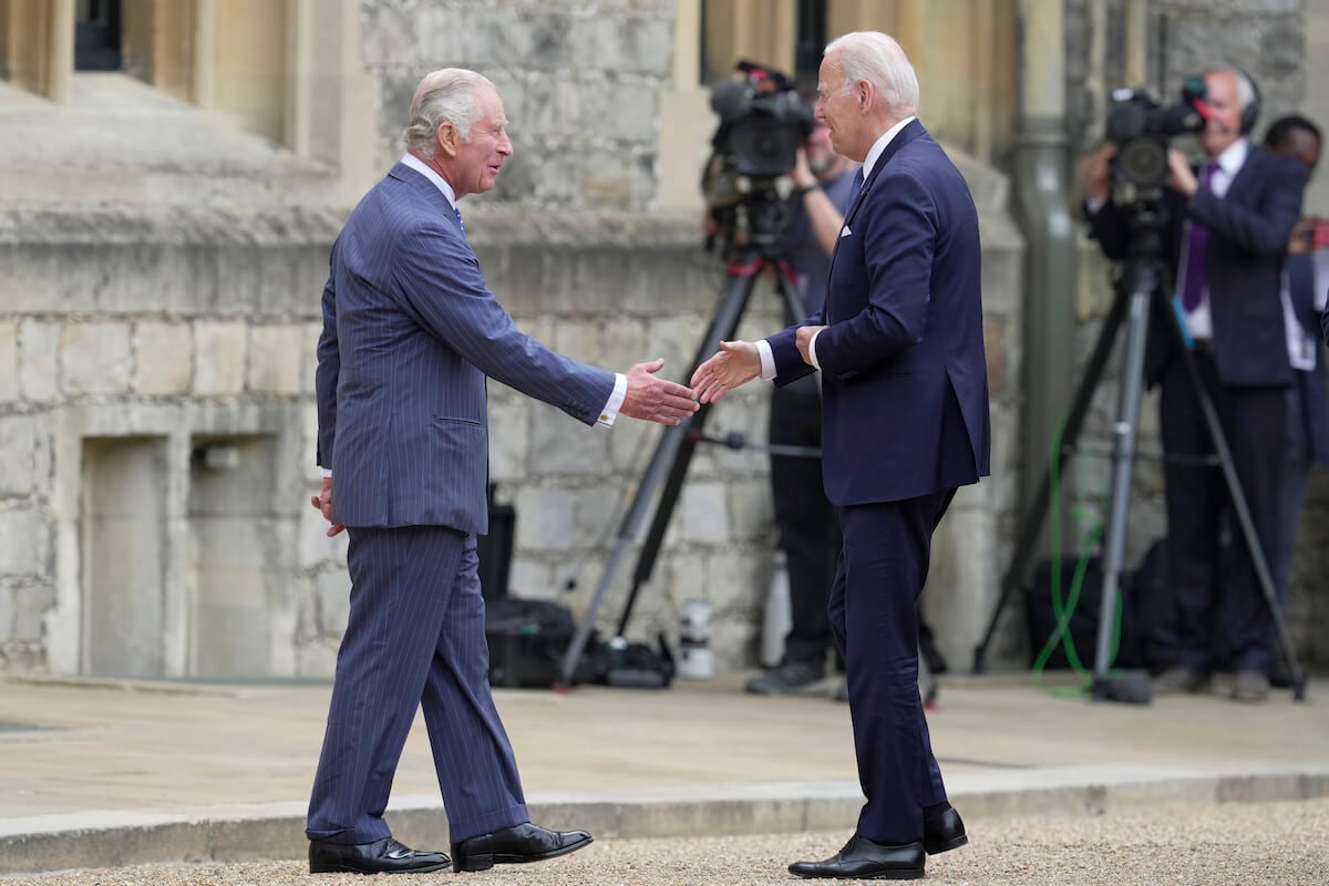 King Charles III greets U.S. President Joe Biden in what experts say wasn't a royal protocol breach in July 2023