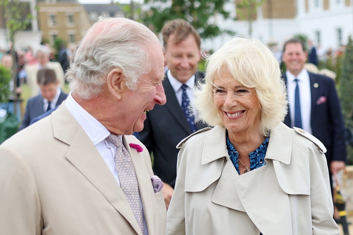 King Charles III, whose former butler says the monarch will give Camilla Parker Bowles some of his mother's jewelry for her 76th birthday, share a laugh