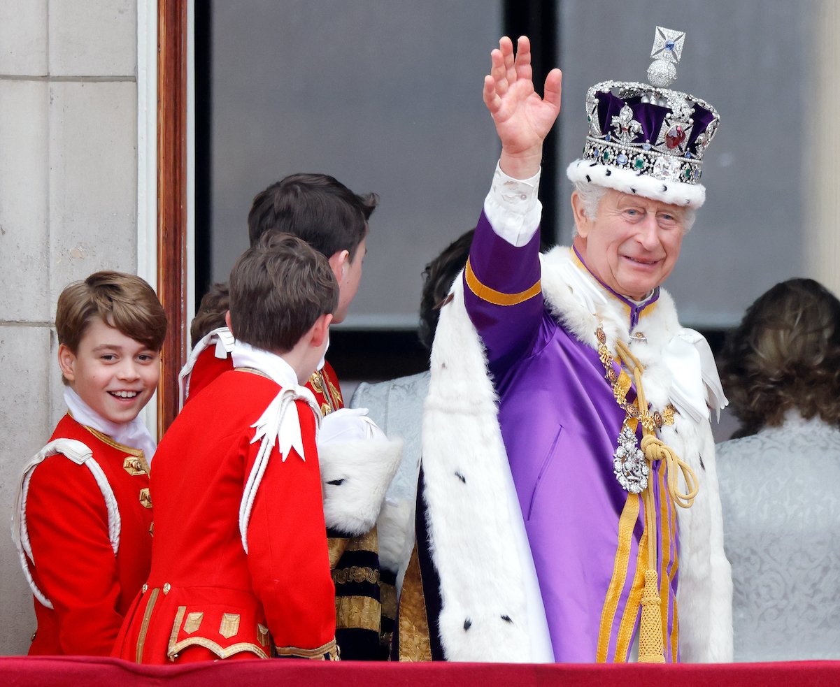 King Charles waves while Prince George smiles at the crowd