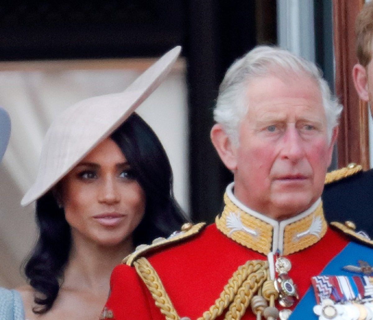 Meghan Markle and now-King Charles III, who both 'absolutely hated' one royal rule, standing on the balcony of Buckingham Palace during Trooping The Colour 2018