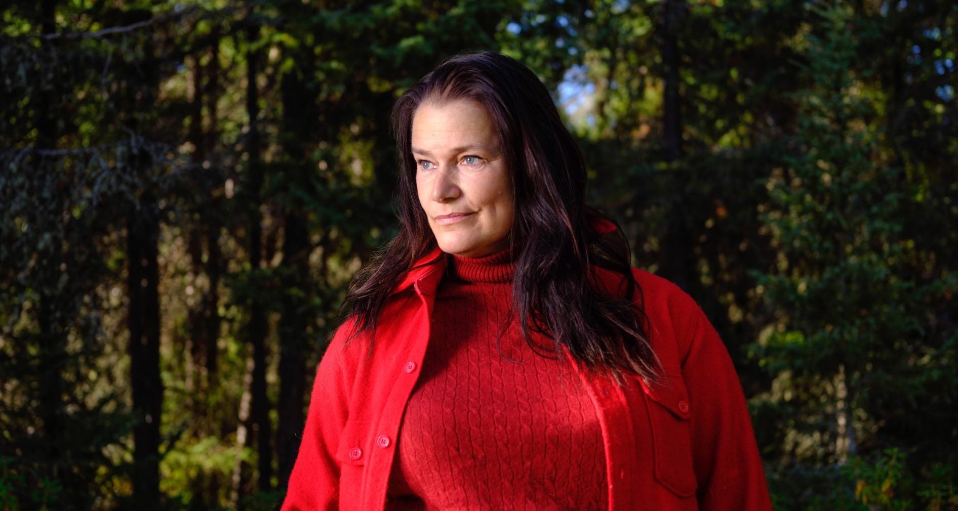 'Alone' Season 10 cast member Melanie Sawyer in a red jacket and sweater