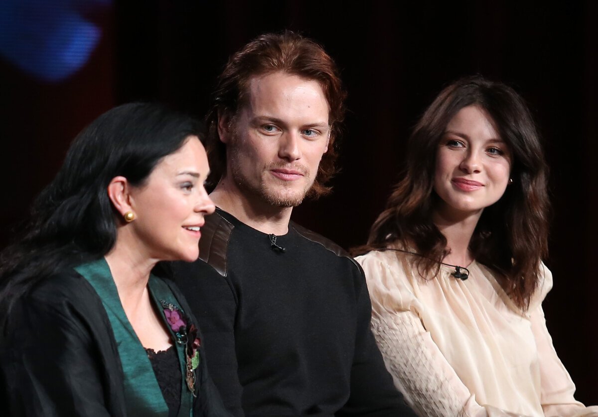 Author Diana Gabaldon, actors Sam Heughan and Caitriona Balfe speak onstage during the 'Outlander' panel discussion at the Starz portion of the 2014 Winter Television Critics Association tour at the Langham Hotel on January 10, 2014 in Pasadena, California