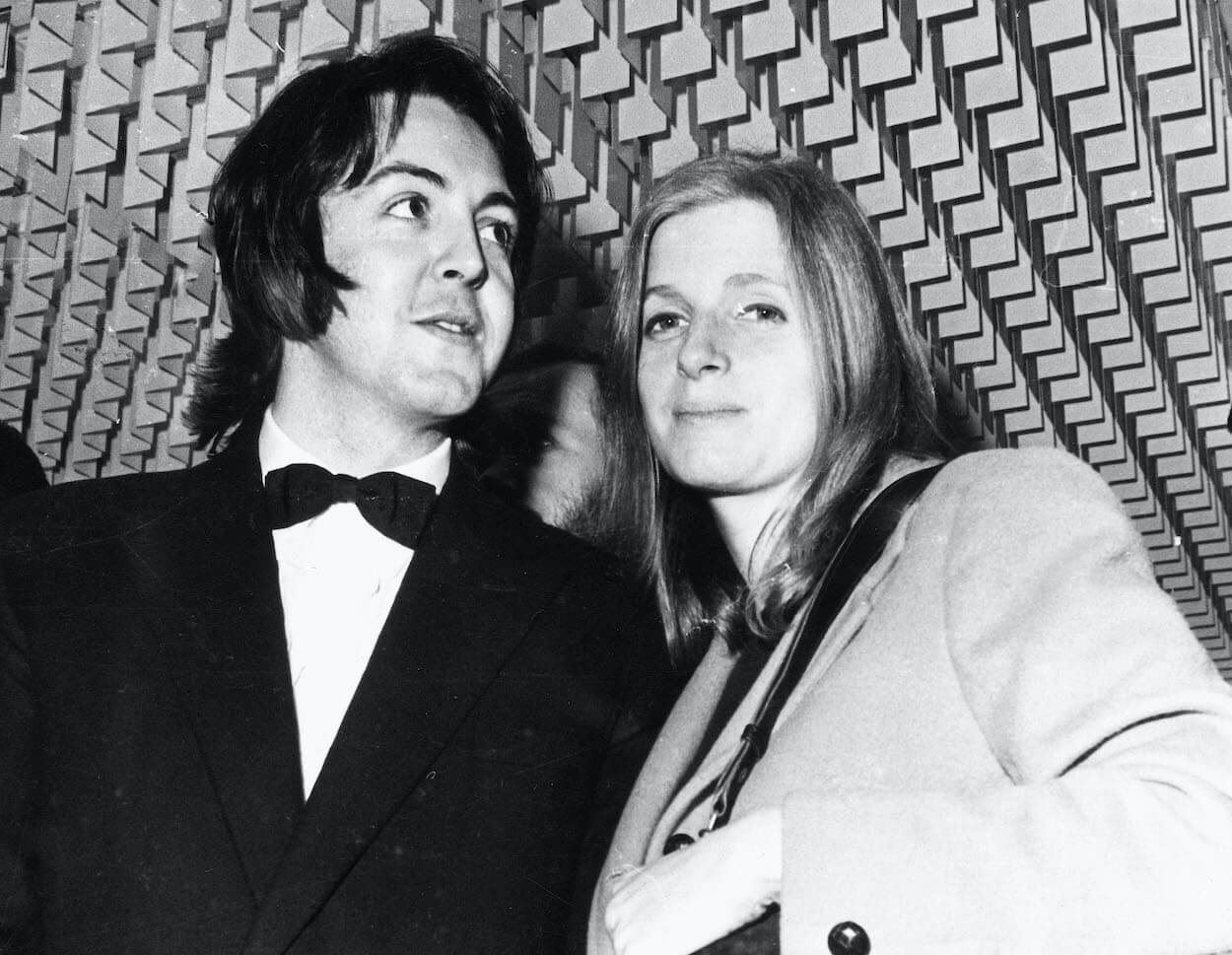 Paul McCartney in a tuxedo standing next to Linda McCartney in December 1969.