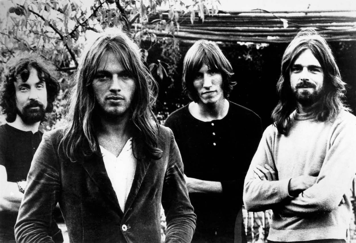 Pink Floyd members (from left) Nick Mason, David Gilmour, Roger Waters, and Rick Wright standing side-by-side.