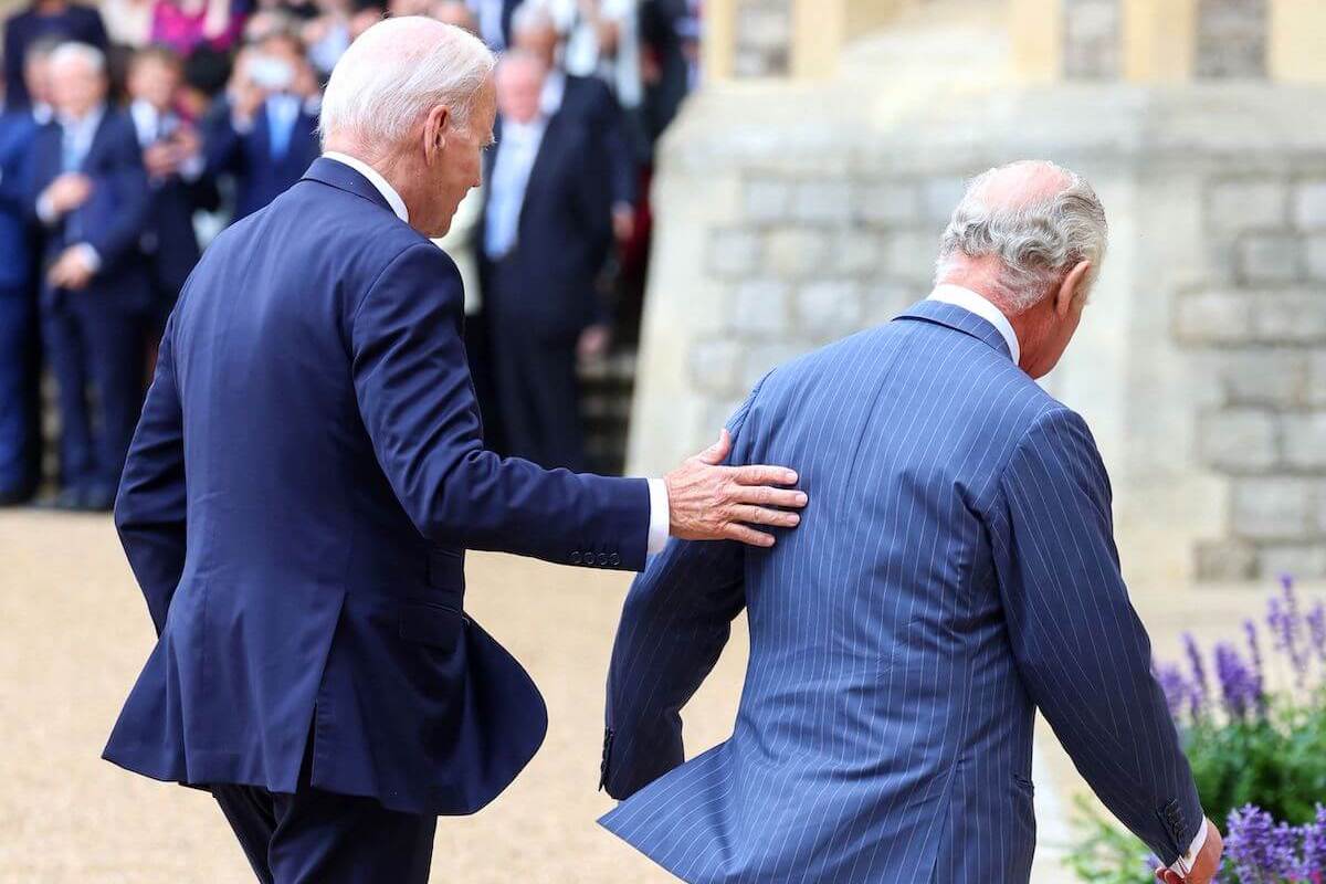 President Joe Biden touches King Charles III's arm in what some experts say wasn't a royal protocol breach on July 10, 2023