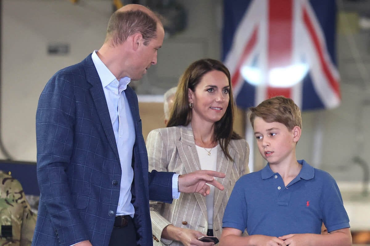 Prince George, who has had a 'baptism of fire,' stands with Prince William and Kate Middleton
