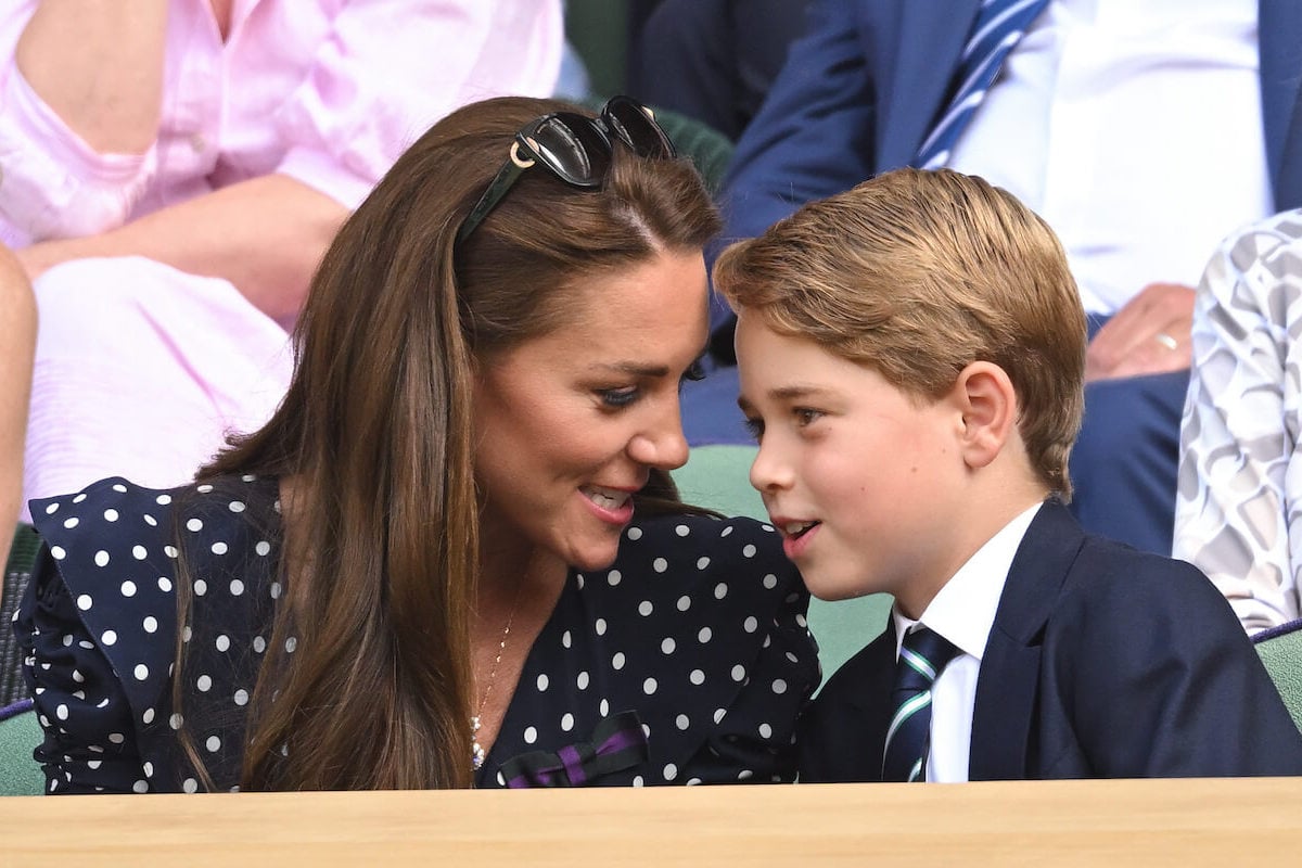 Prince George, who will be a 'more personable and empathetic monarch' because of Kate Middleton, per an expert, sits with his mother