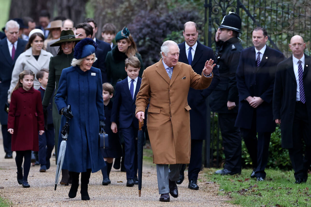 Prince George, whose heir status doesn't impact the Wales's 'family life,' walks with Prince William, Kate Middleton, Princess Charlotte, Prince Louis, Queen Camilla, and King Charles III