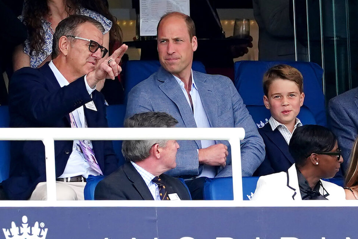 Prince George, whose public displays of affection, or PDA, with Prince William and Kate Middleton have declined since he started wearing suits, according to an expert, watches cricket