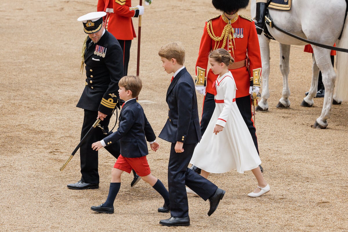Prince George, whose relationship with Princess Charlotte and Prince Louis the royal family are 'aware' of, walks with his sister and brother