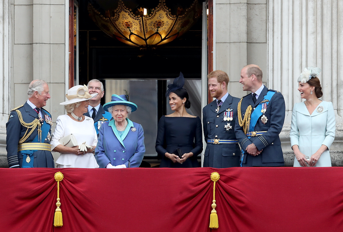 The royal family stands on the balcony of Buckingham Palace