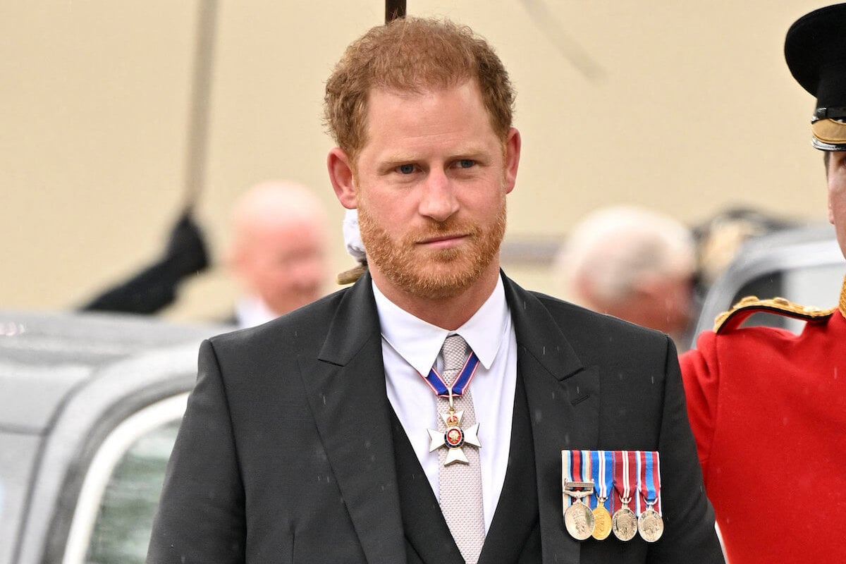 Prince Harry, whose Dior suit at King Charles III's coronation sent a 'message,' according to an expert, looks on