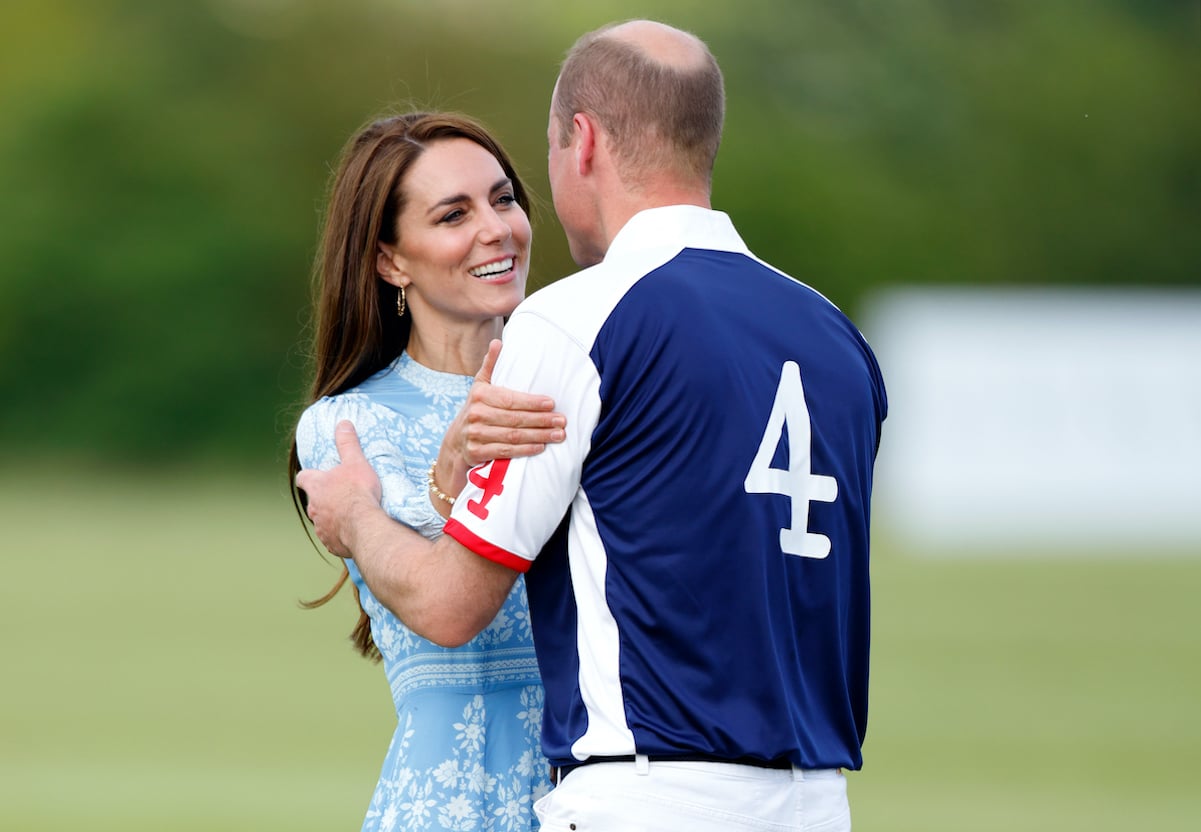 Kate Middleton and Prince William embrace at William's charity polo match in July 2023