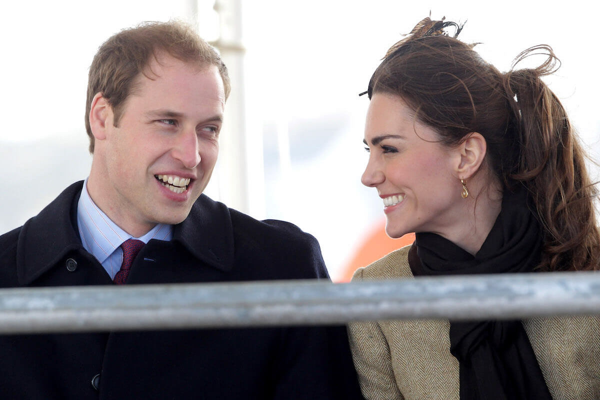 Prince William and Kate Middleton, whose 'normal life' is over, smile and look at each other