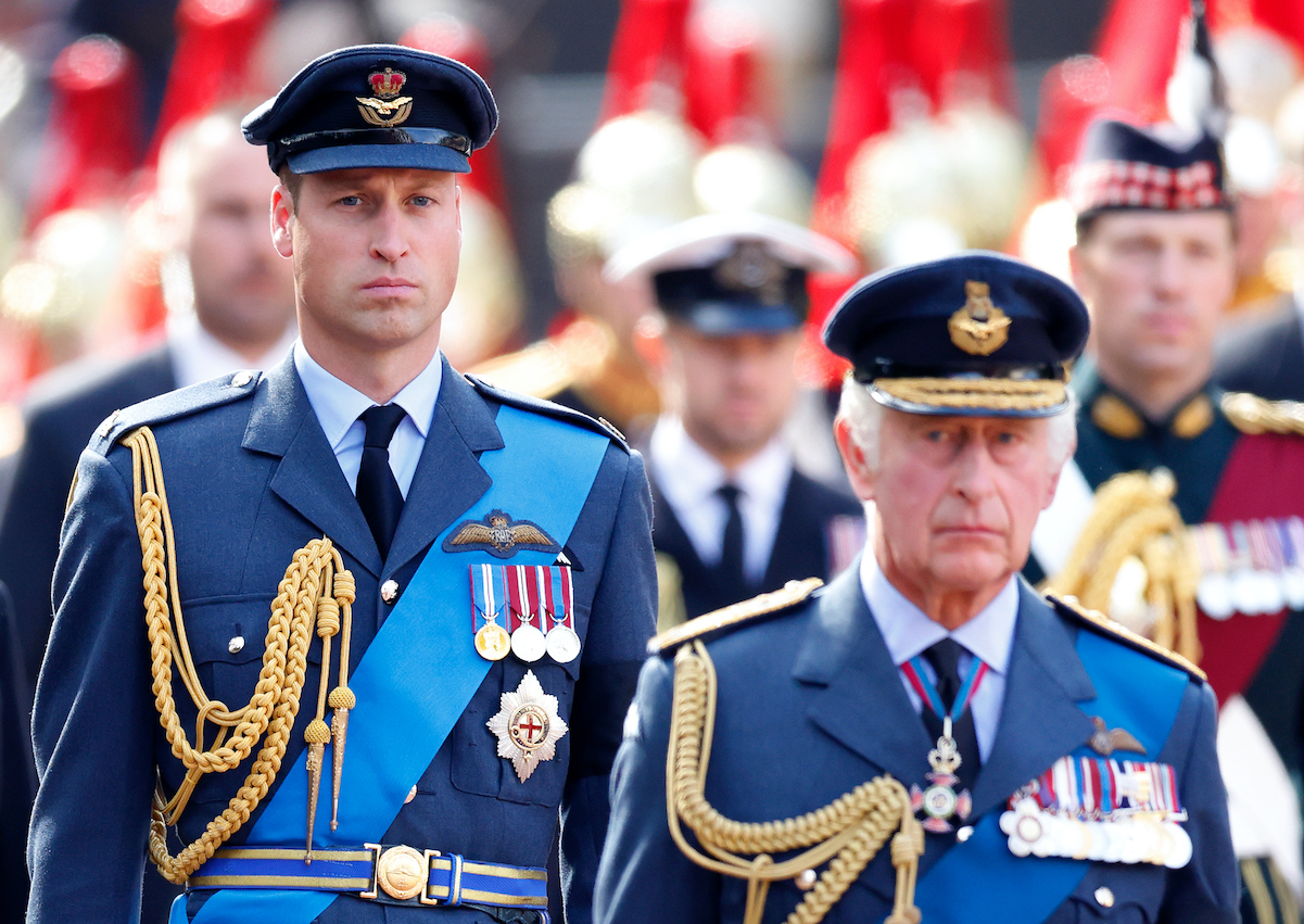 Prince William walks behind his father, King Charles