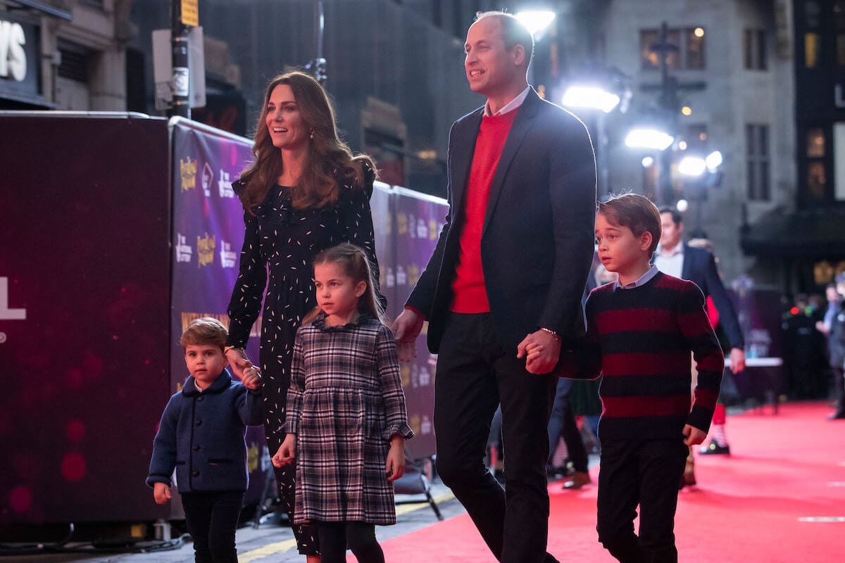 Princess Charlotte, who dropped Prince William's hand, walks the red carpet with Prince Louis, Kate Middleton, Prince William, and Prince George