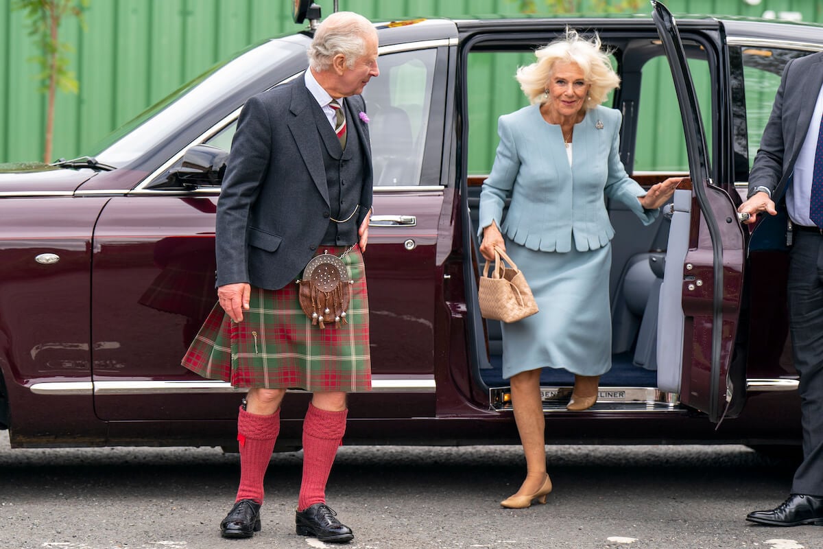 Queen Camilla, whose 'subtle' PDA with King Charles III includes a 'Courtier's Nod,' according to a body language expert, exits a vehicle behind her husband
