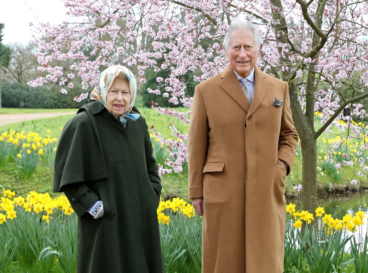 Queen Elizabeth II and then-Prince Charles, who will 'put on a brave face' when he returns to Balmoral for the summer where he said goodbye to his mother, pose in the garden of Frogmore House