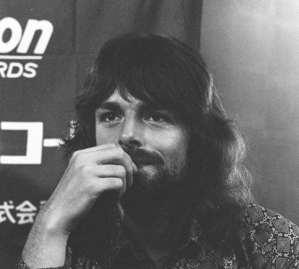 Pink Floyd keyboard player Rick Wright put his hand to his mouth during a 1971 press conference.