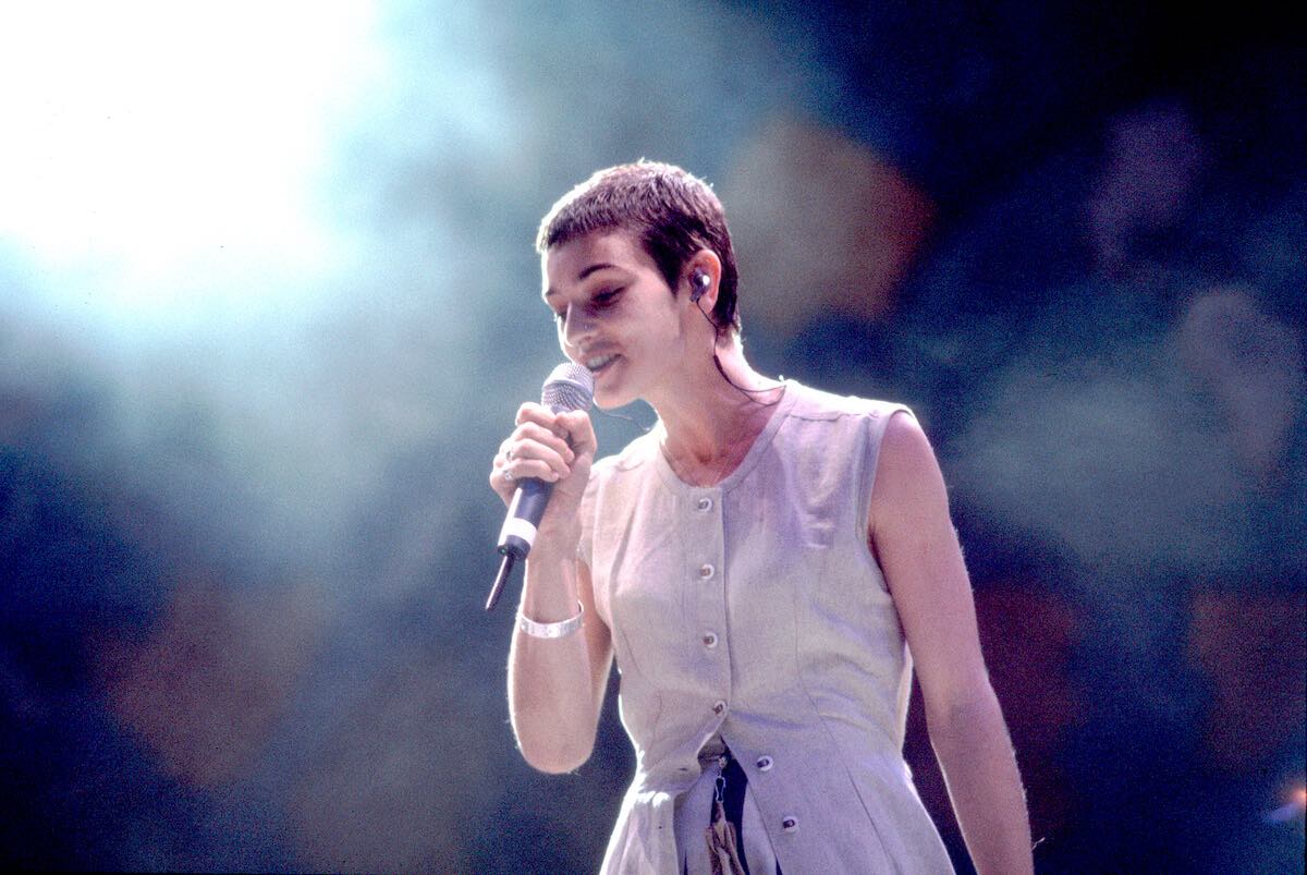 Sinead O'Connor performing on stage in 1993