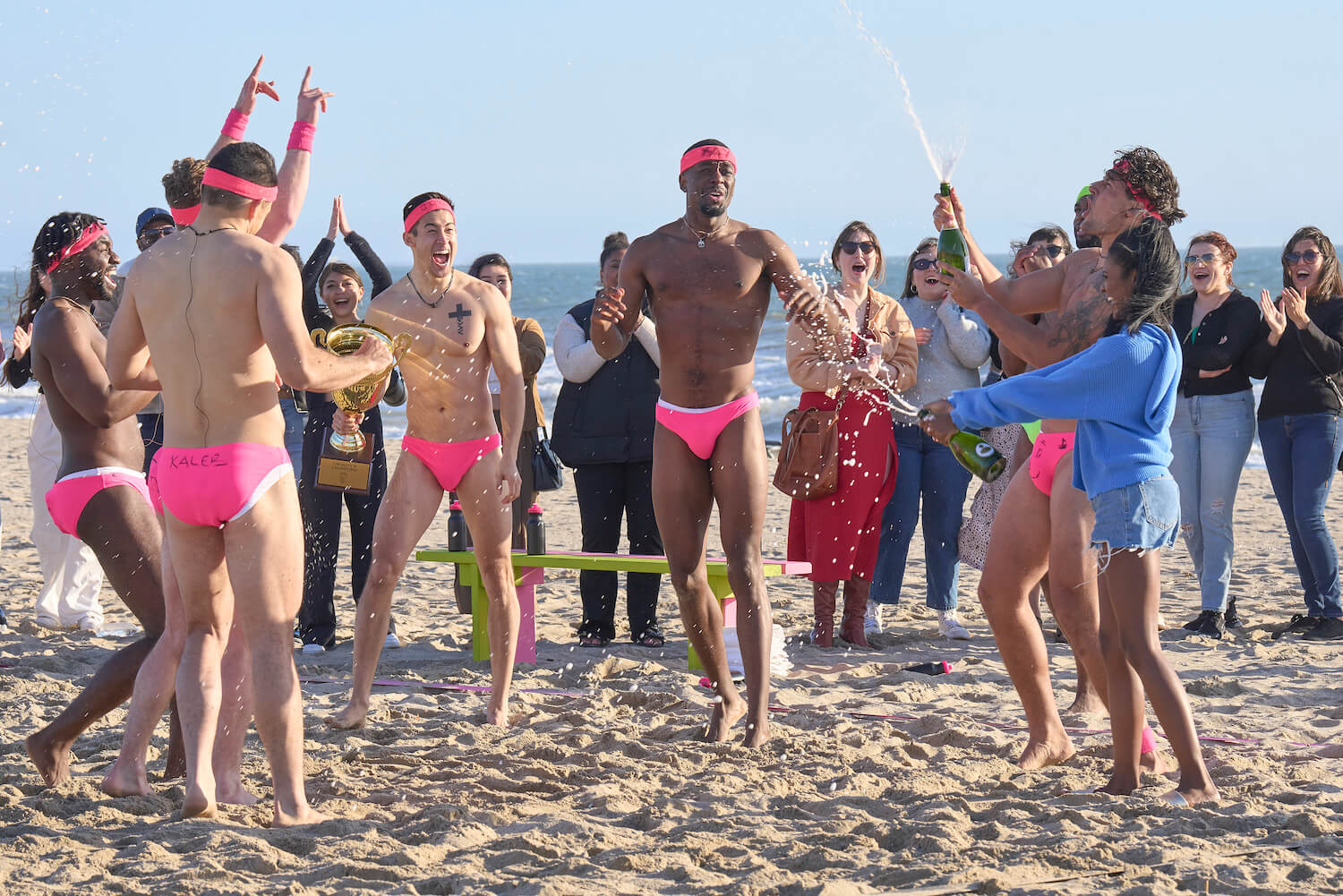 Men from 'The Bachelorette' 2023 in Speedos on the beach during a group date in episode 3