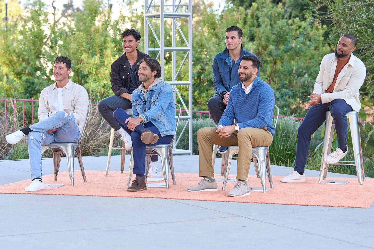 Men from Charity Lawson's season of 'The Bachelorette' 2023 sitting in chairs during a group date in episode 3