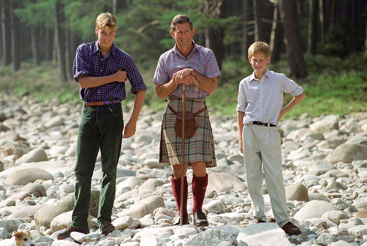 Then-Prince Charles with Prince William and Prince Harry by The River Dee at the Balmoral Castle estate