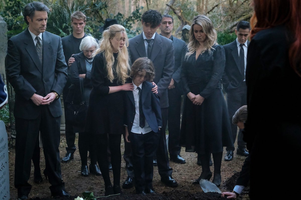 A group of mourners at a funeral in 'V.C. Andrews' Dawn' Part 4 'Midnight Whispers'