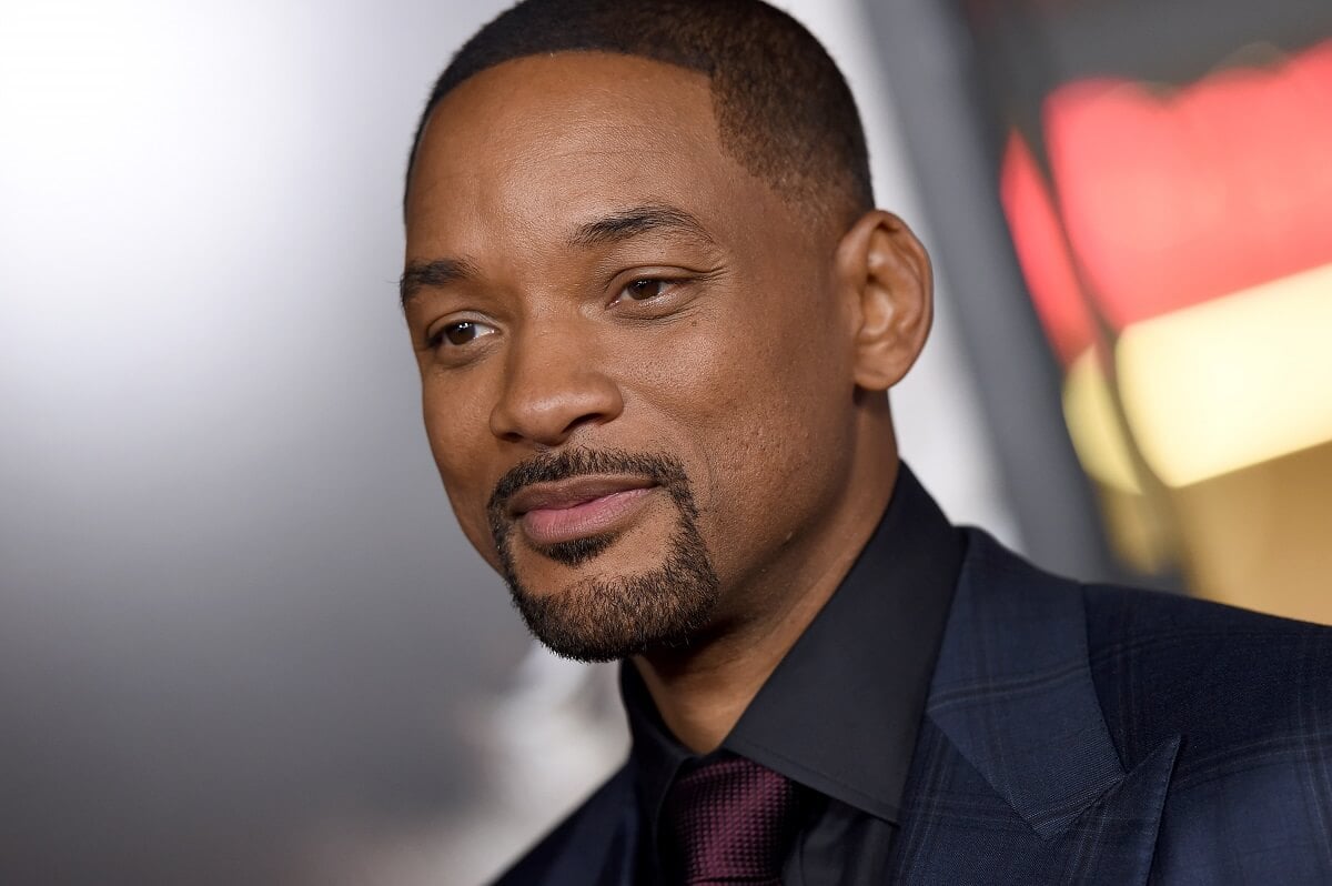 Will Smith posing in a suit at the 2015 AFI Fest.