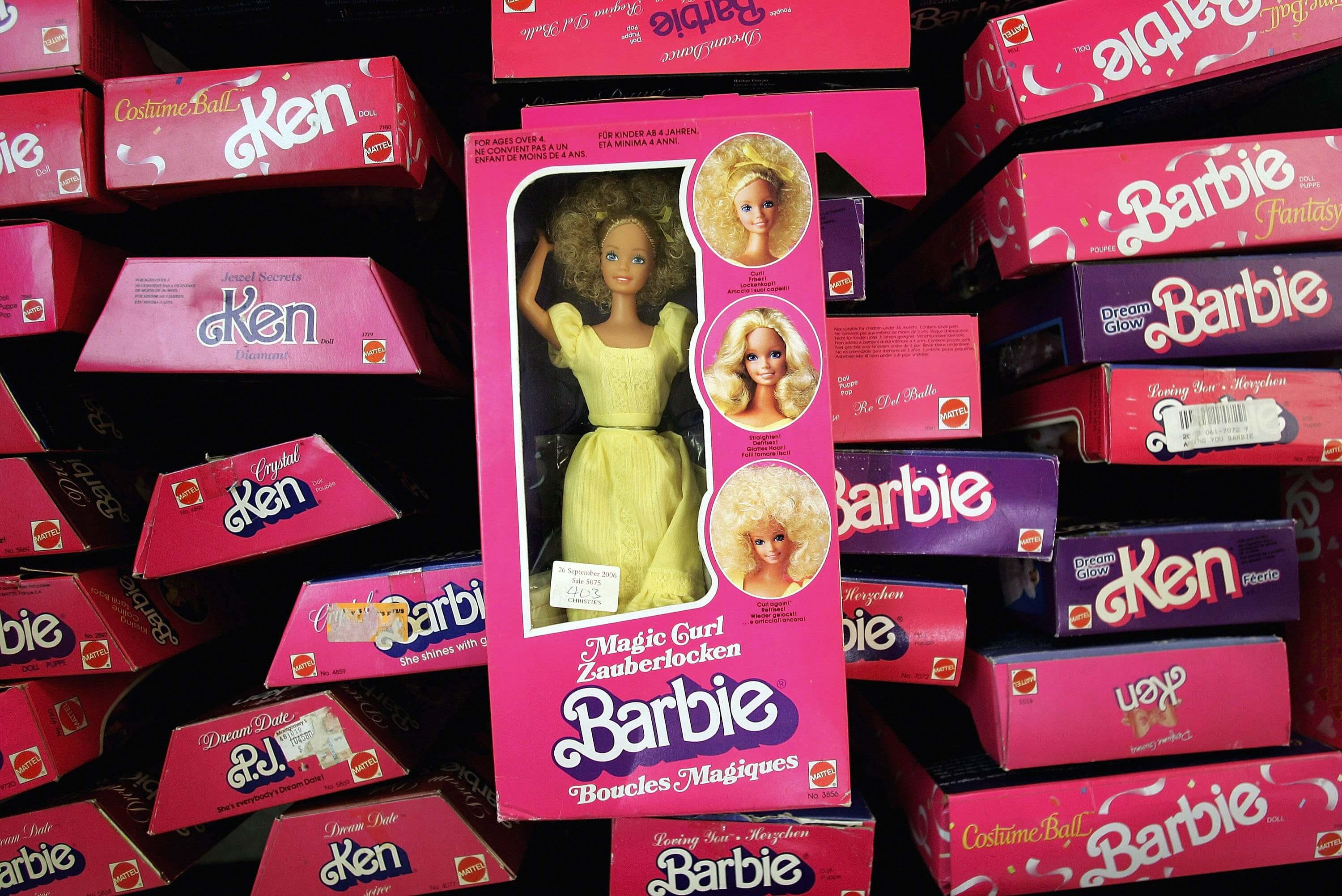 Barbies, the subject of Aqua's "Barbie Girl," in pink boxes