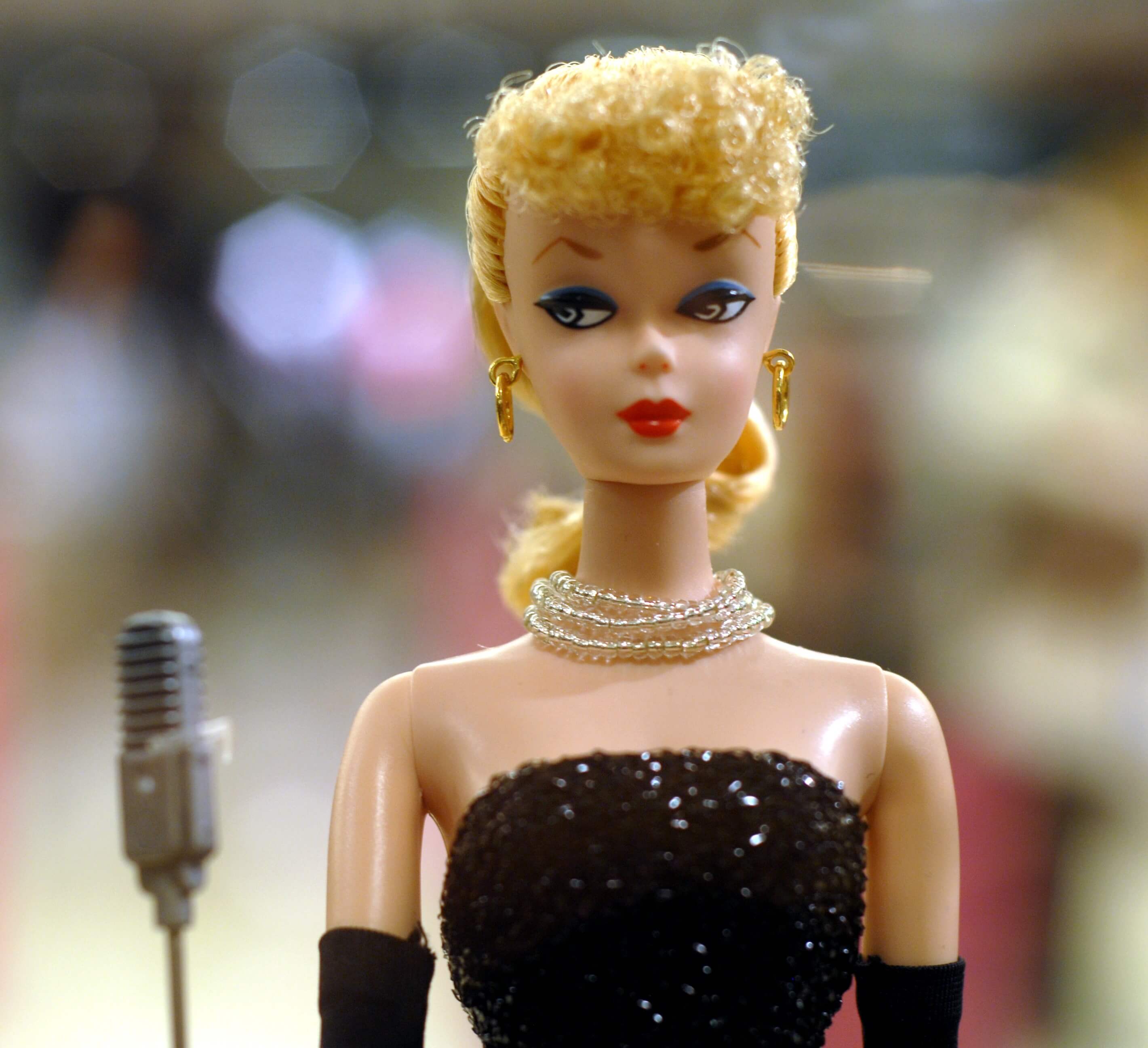 Barbie, the star of the movie 'Barbie', with a microphone