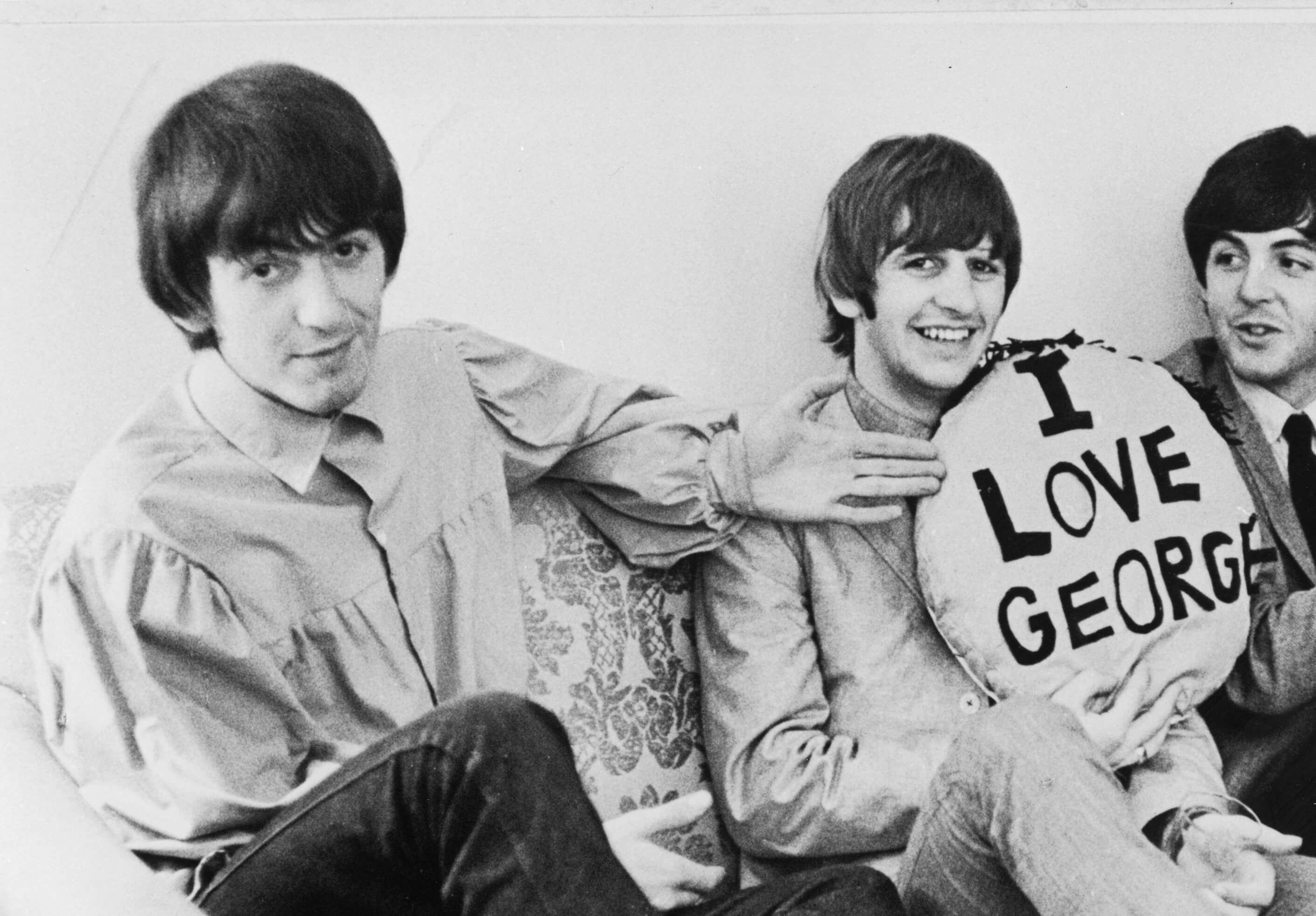 George Harrison and Ringo Starr with a pillow