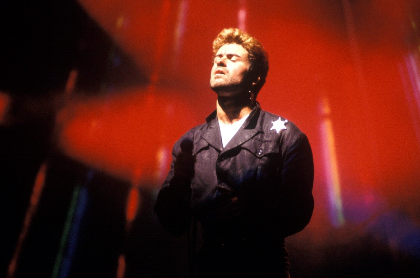 George Michael on stage with eyes closed