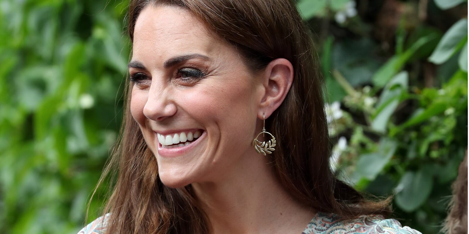 Kate Middleton holds a camera as she takes part in a a photography workshop with the charity 'Action for Children' in Kingston, southwest London on June 25, 2019.