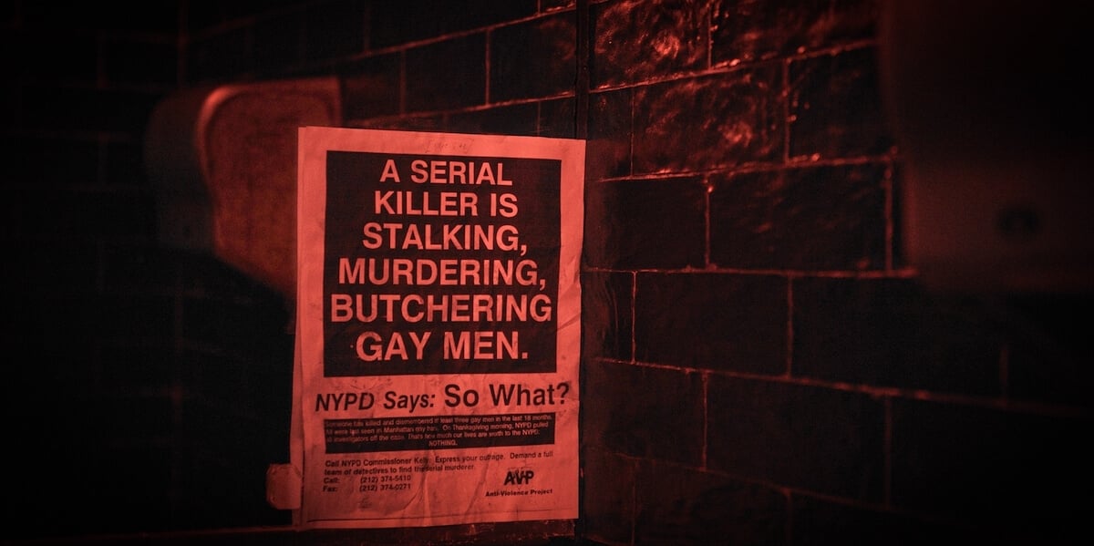 Poster on brick wall warning of 'a serial killer stalking, murdering, and butchering gay men'