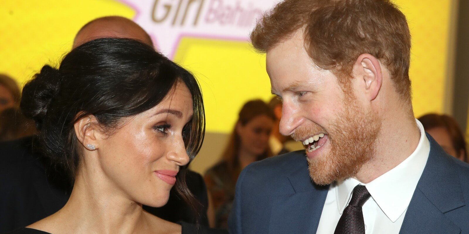 Meghan Markle smiles at Prince Harry in 2018.